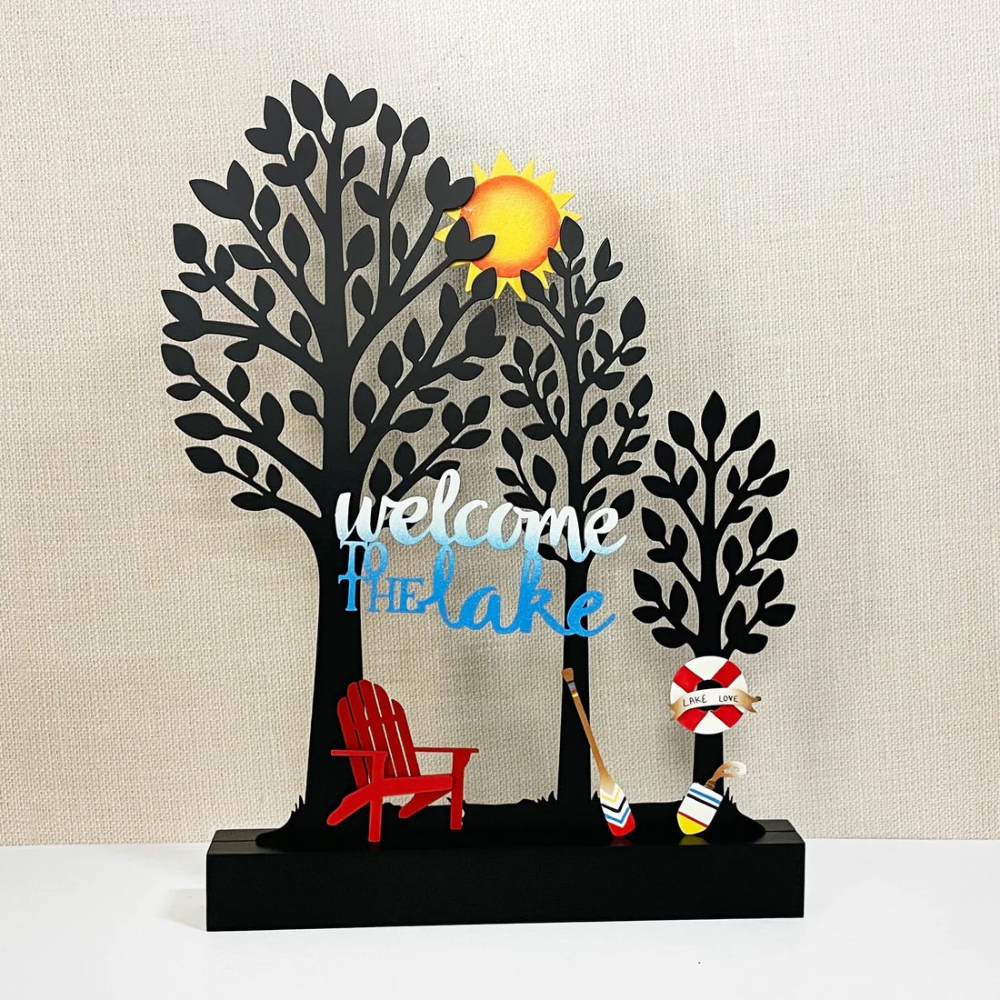 Three black tree memo board decorated with magnets. 