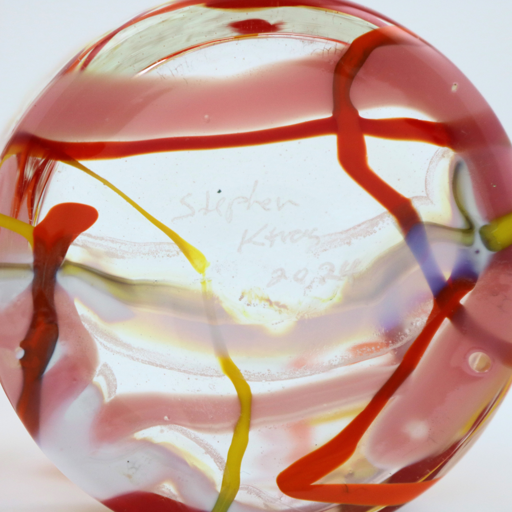 Base of a drinking glass signed by Stephen Kitras