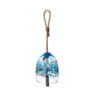 A clear glass bell with opaque white, blue, red, green and yellow swirled in across the middle. A wooden toggle and rope are pulled through the middle. On a transparent background. 